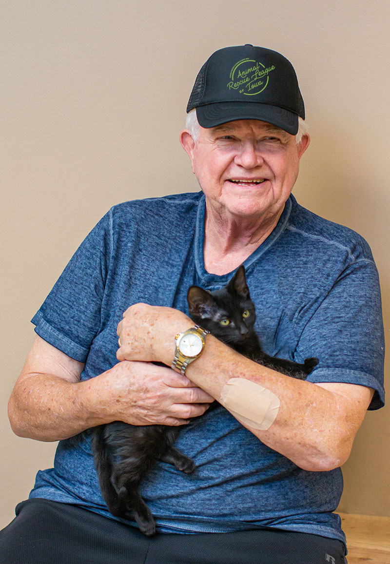 Ron with a black kitten